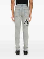 Amiri Blue Skinny-fit Logo-appliquéd Staggered Jeans