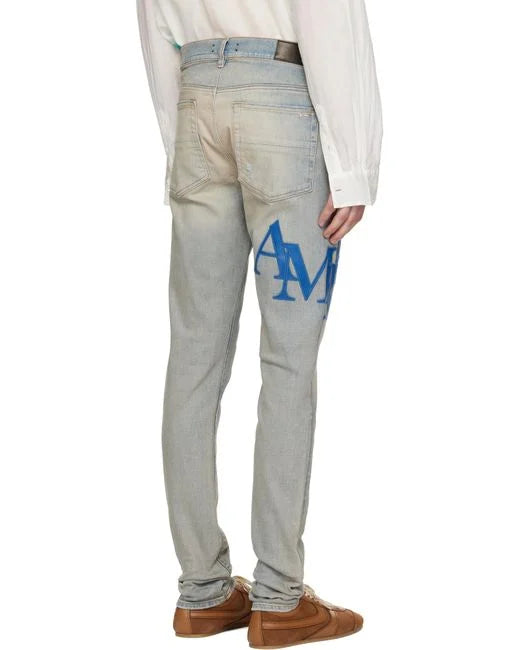 Amiri Blue Skinny-fit Logo-appliquéd Distressed Jeans
